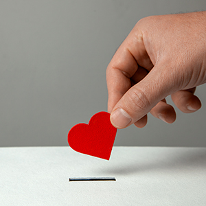 Donation heart going into a box