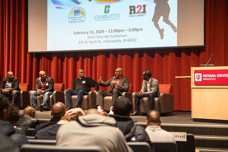 Panel members addressing the crowd